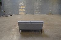 Sofa zwei R&uuml;ckansicht in alter Industriehalle